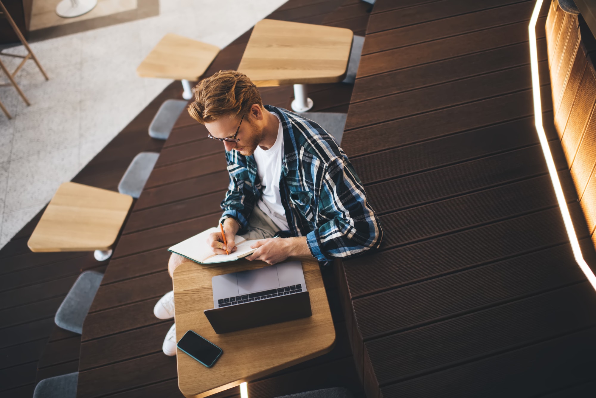 Guy working or studying in coworking office space